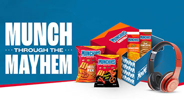 Copy on the left side of the image says, “Munch through the Mayhem” with the Munchies Survival Kit to the right.